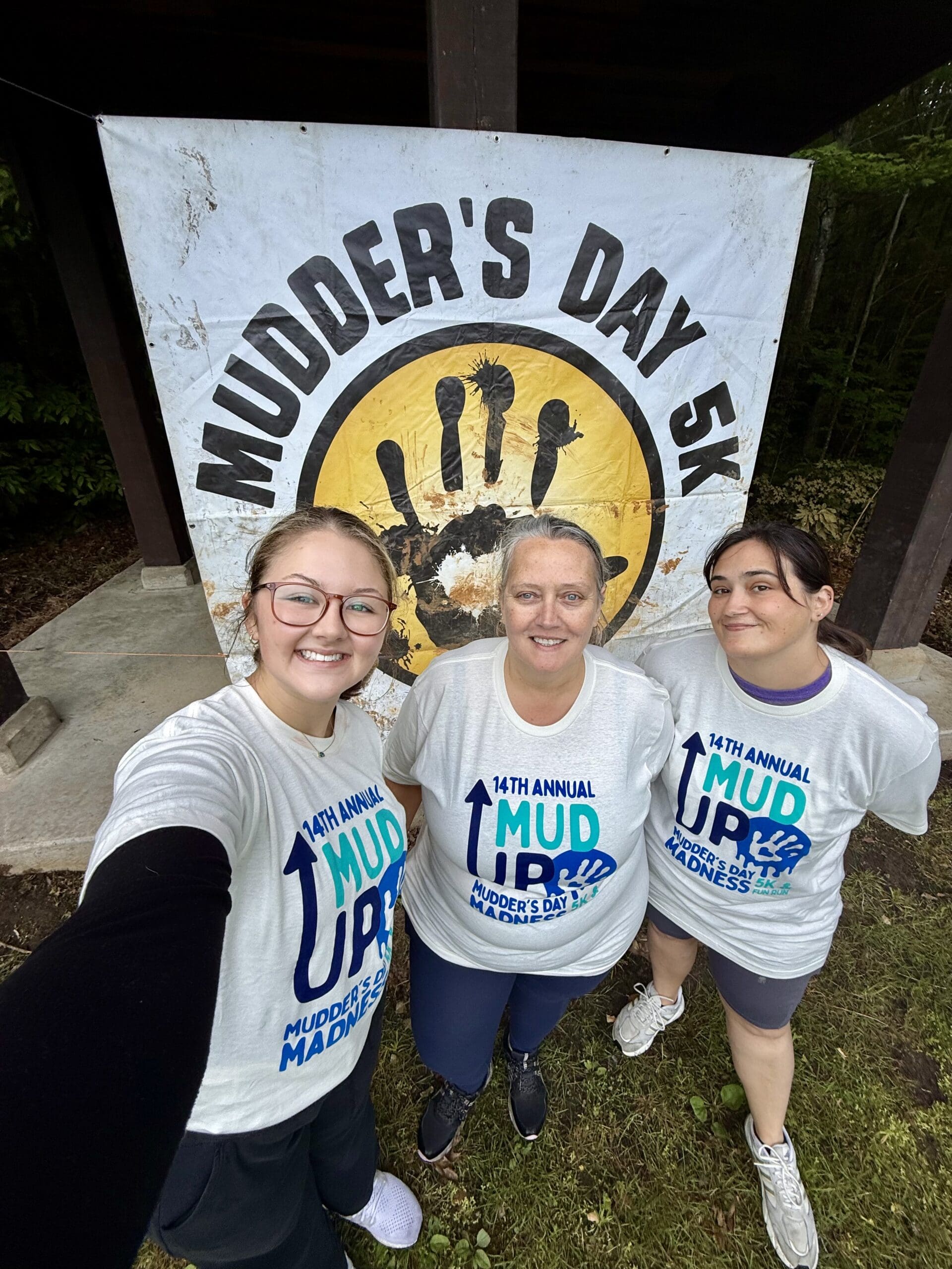 3 volunteers at Mudder's Day Run