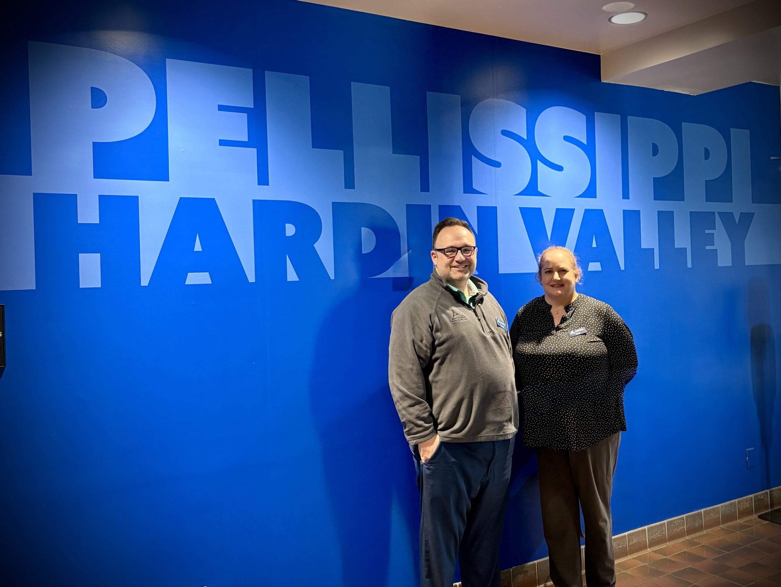 Chuck and Lisa stand in front of a wall that reads Pellissippi Hardin Valley